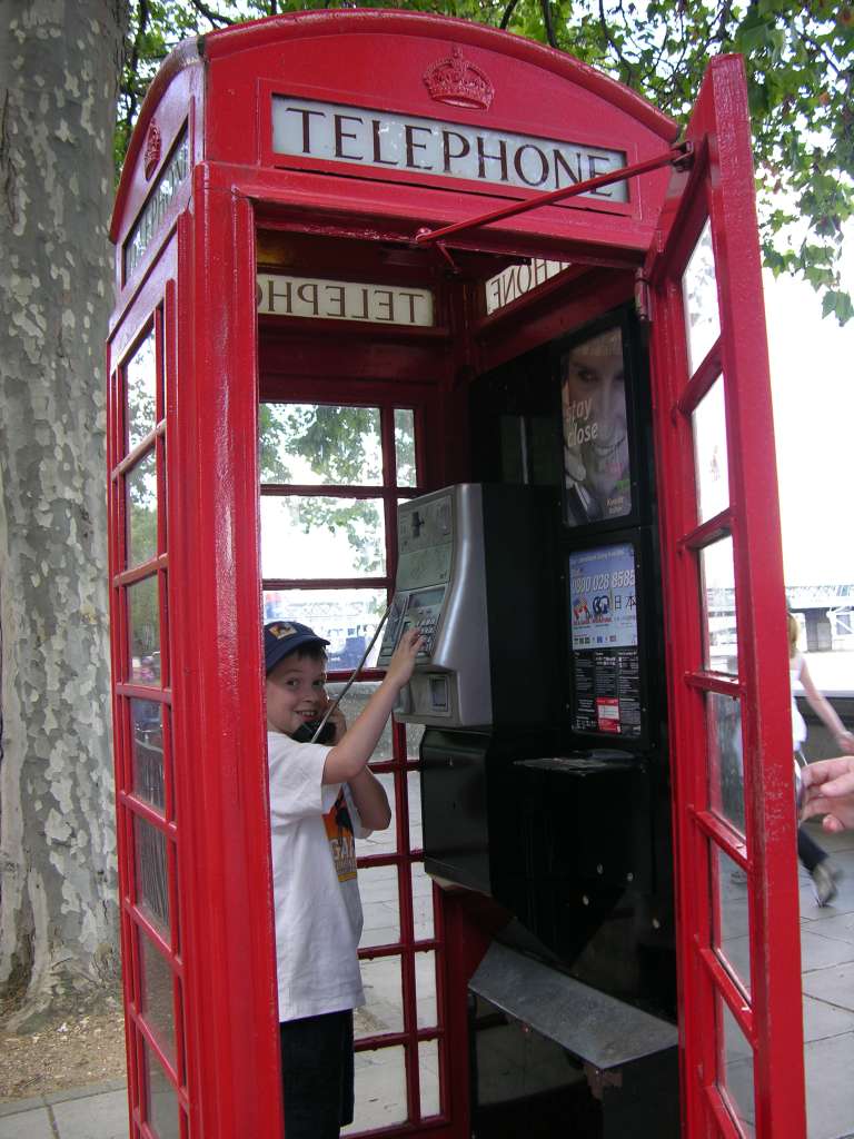 London 01 05 Red Telephone Booth �Hello operator. Can you give me number nine? Can I see you later? Will you give me back my dime?� (The White Stripes) Peter enjoys one of London�s most famous tourist symbols, the red payphone.